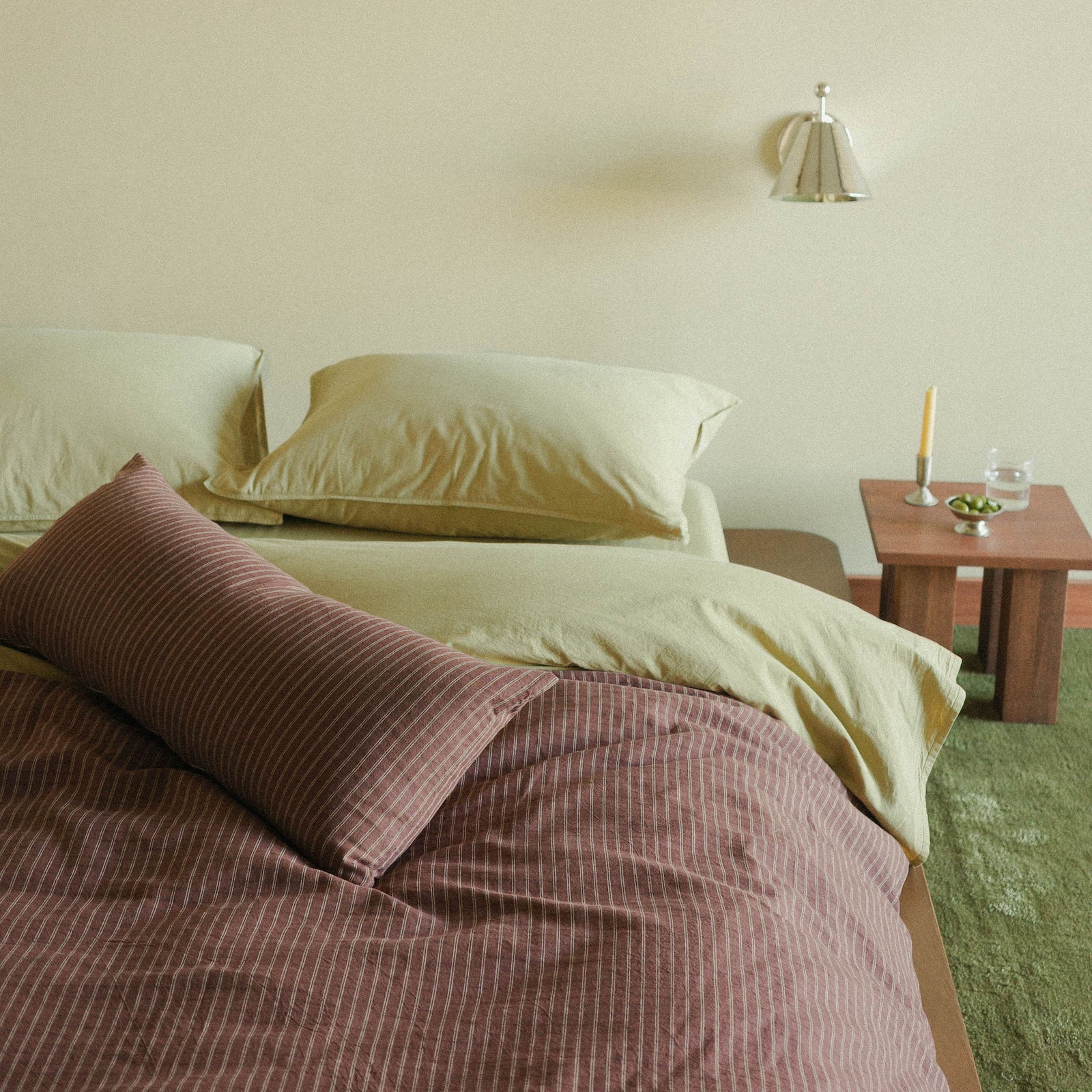 Morrow Soft Goods Juno Check Duvet and Lumbar with Organic Percale Sheets in Pale Olive lifestyle image 