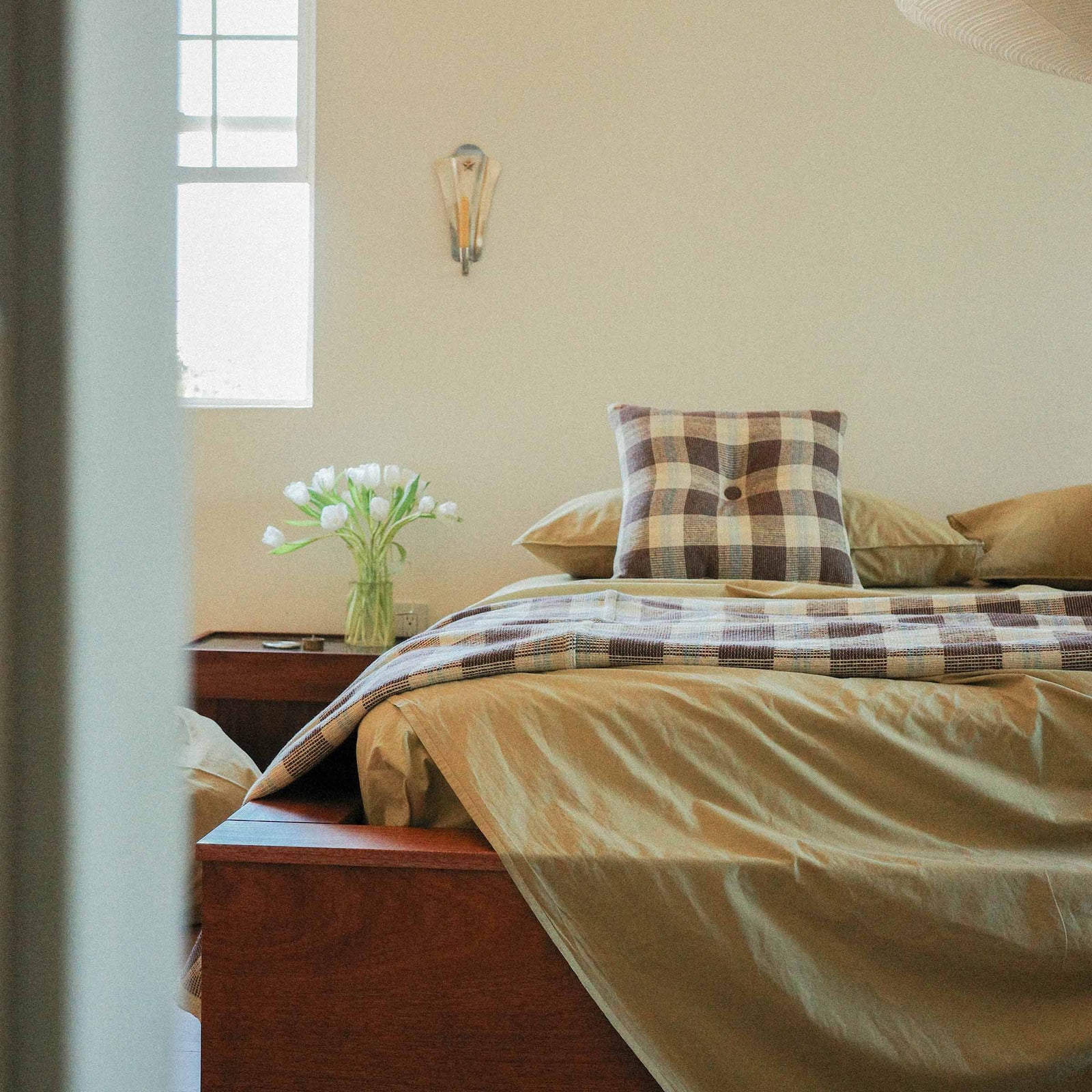 Morrow Soft Goods Pairing Mina Coverlet and Throw Pillow with Organic Percale Sheets in Pale Olive -bedroom lifestyle image.