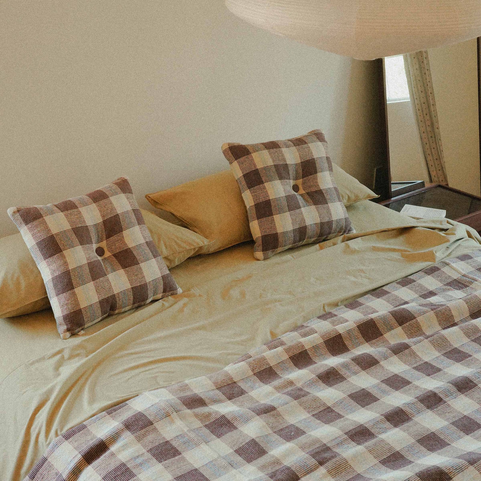Morrow Soft Goods Pairing Mina Coverlet and Throw Pillows with Organic Percale Sheets in Pale Olive -bedroom lifestyle image.