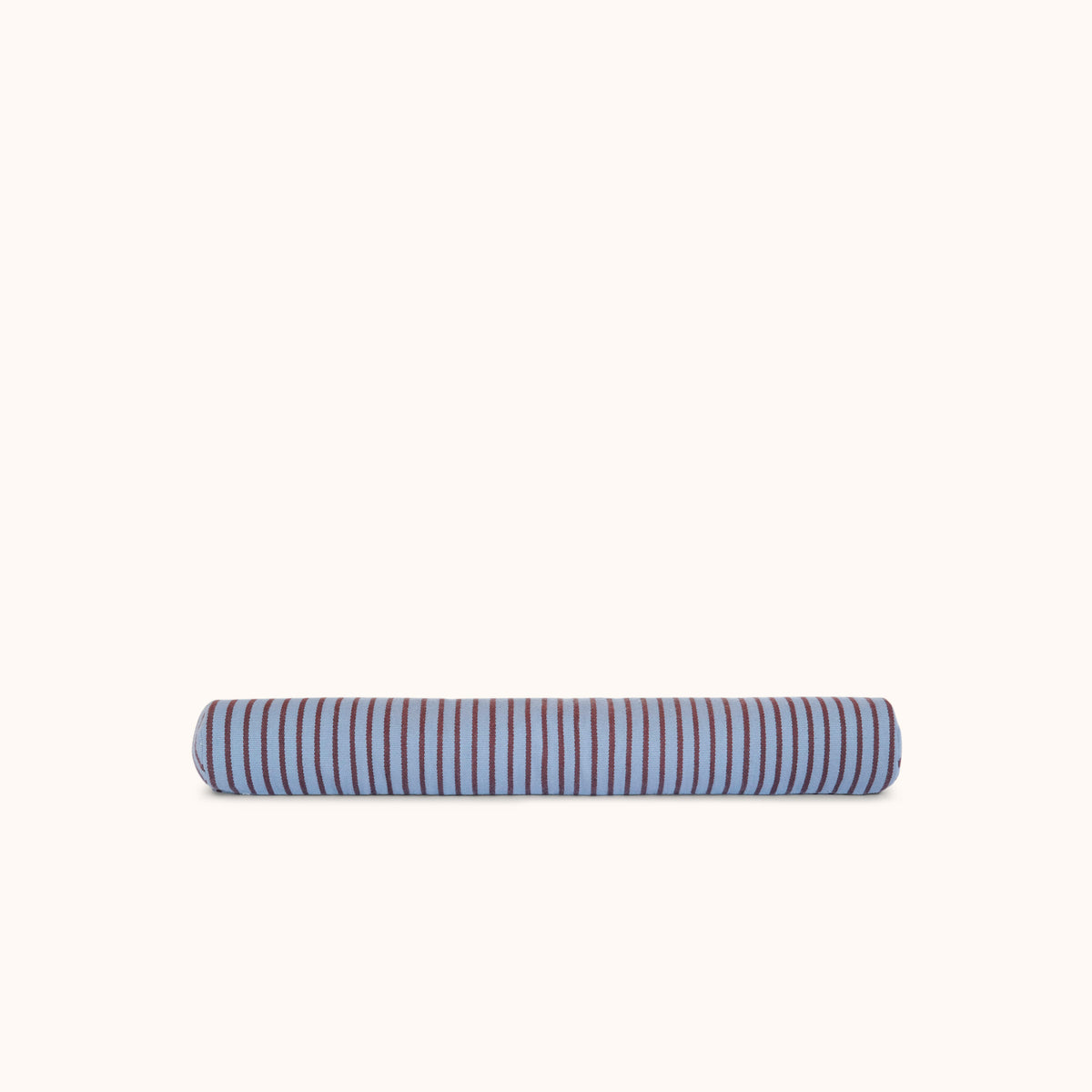 A long cylindrical bolster pillow with alternating blue and brown stripes