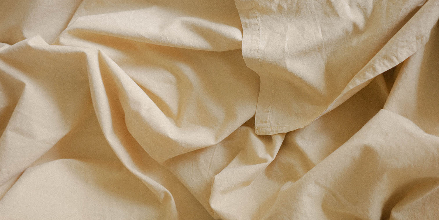 close up of butter yellow percale cotton fabric