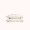 Two oat organic matte sateen pillowcases stacked neatly against a white background
