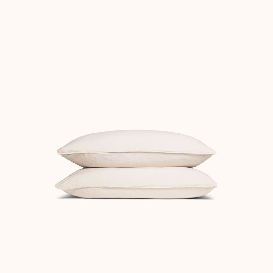 Two oat organic matte sateen pillowcases stacked neatly against a white background